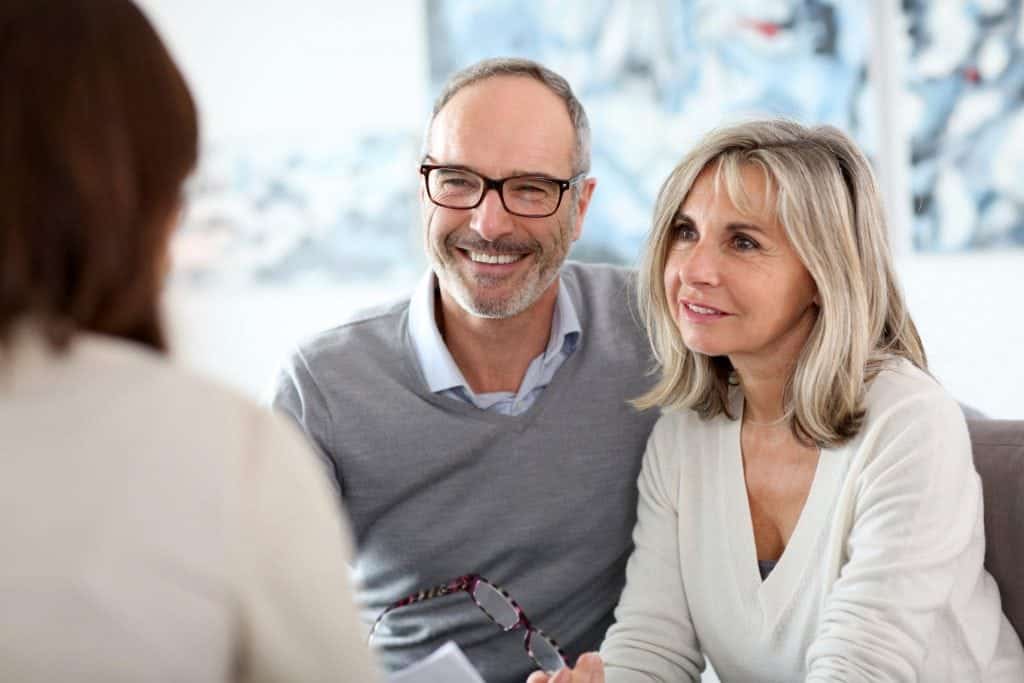 Senior couple meeting Timeshare specialist lawyer for help