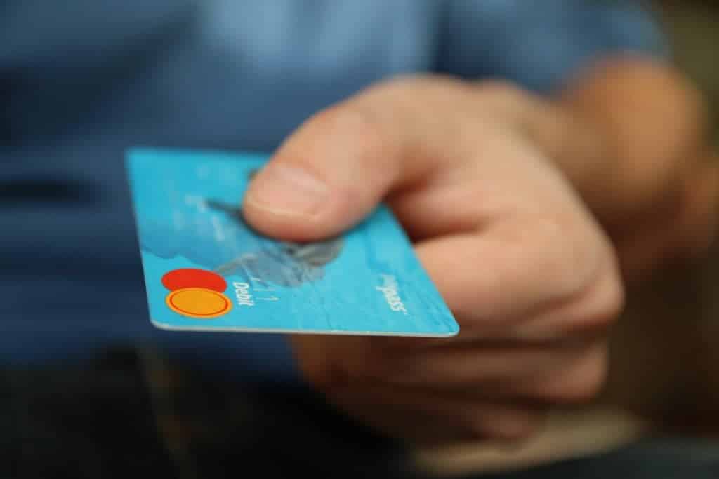Person handing over credit card