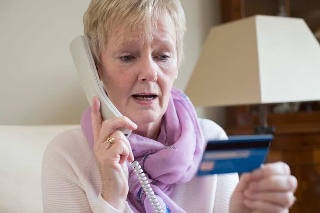 Woman who has been cold called by timeshare scammers