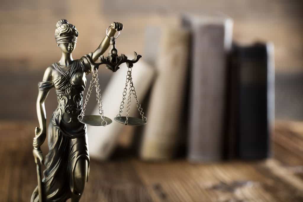Scales of justice with law books
