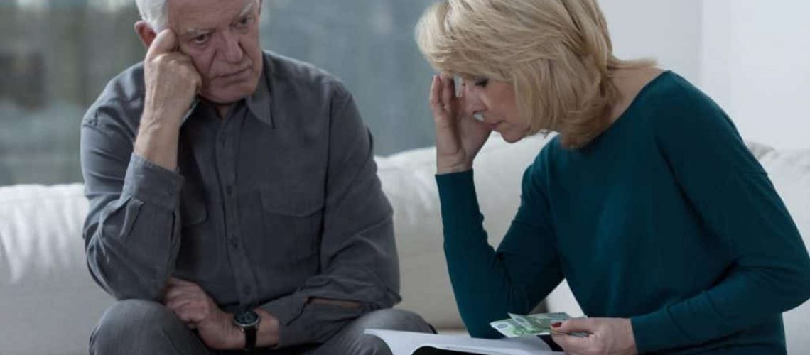 Picture of older couple troubled by timeshare agreement problems